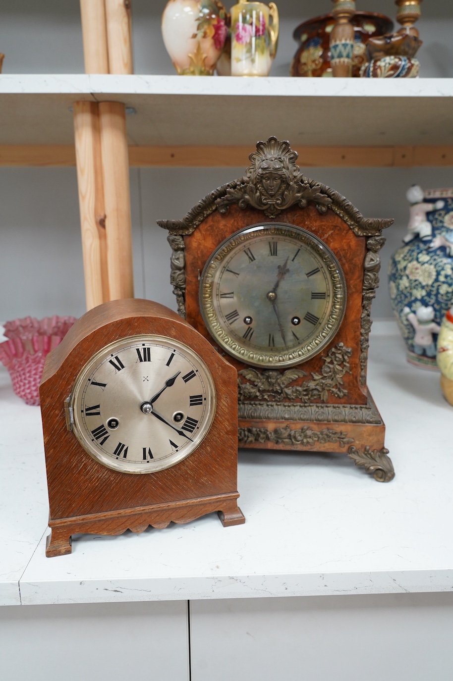 A late 19th century brass mounted burr walnut bracket clock with key and pendulum, and an oak mantel clock, tallest 37cm. Condition - poor to fair